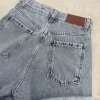 SD476 - Short Denim Celeste Rígido Tachitas (Petal) - Imagen 4
